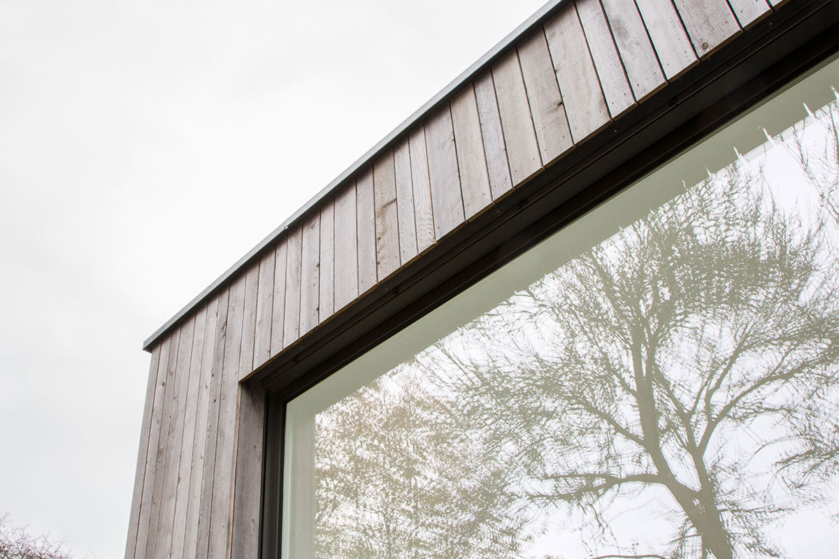 Holzbau-Dahm, Referenz, Bugalow, Holzrahmenbau, Einfamilienhaus, Holzhaus, Fassade in vorvergrauter Weisstanne